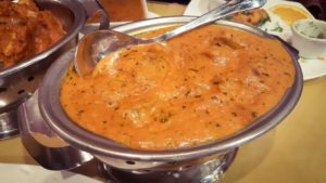 photo of the beef vindaloo served on a shimmering pot