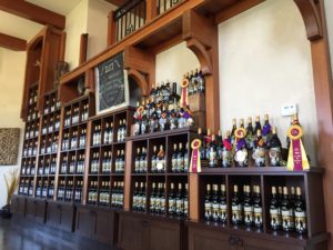 the shelves of Moon Curser Vineyards tasting room also showcasing their award winning wines