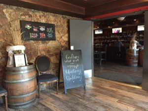 the lobby area of The Noble Pig that leads to the Pub area of the facility